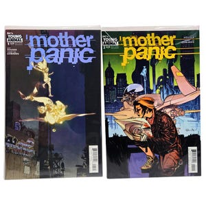 May include: Two comic books from the DC's Young Animal series, "Mother Panic." The first cover features a figure in flight, while the second shows a person kneeling near a futuristic vehicle. Both covers have the title in large, stylized letters.