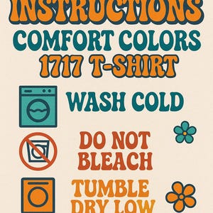 A retro-style care instructions graphic for a Comfort Colors 1717 T-shirt. The orange and teal text on a cream background details washing instructions: wash cold, do not bleach, tumble dry low, and do not iron.