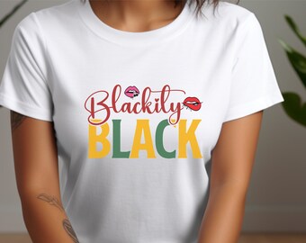 May include: White t-shirt with the text "Blackily BLACK" in red, yellow, and green. The word "Blackily" is in a cursive font, and the word "BLACK" is in bold, block letters. The design includes a pair of red lips.