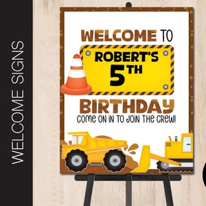 May include: A welcome sign for a construction-themed birthday party. The sign is yellow and black with the text "Welcome to Robert's 5th Birthday Come on in to join the crew!"  The sign also features a cartoon construction cone and two cartoon construction vehicles.