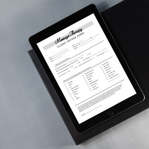 May include: A black and white digital tablet displaying a massage therapy client intake form. The form includes questions about personal information, medical history, and preferences for massage.