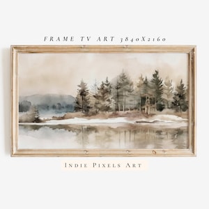 May include: A framed watercolor painting of a forest scene with a lake in the foreground. The trees are a muted green and brown, and the lake is a light blue with a reflection of the trees. The painting is set against a light brown background.