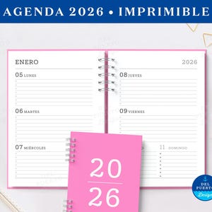 May include: Pink 2026 agenda with spiral binding, open to a weekly view. The cover of the agenda is visible, displaying the numbers "20 26" in white. The top banner reads "AGENDA 2026 • IMPRIMIBLE".