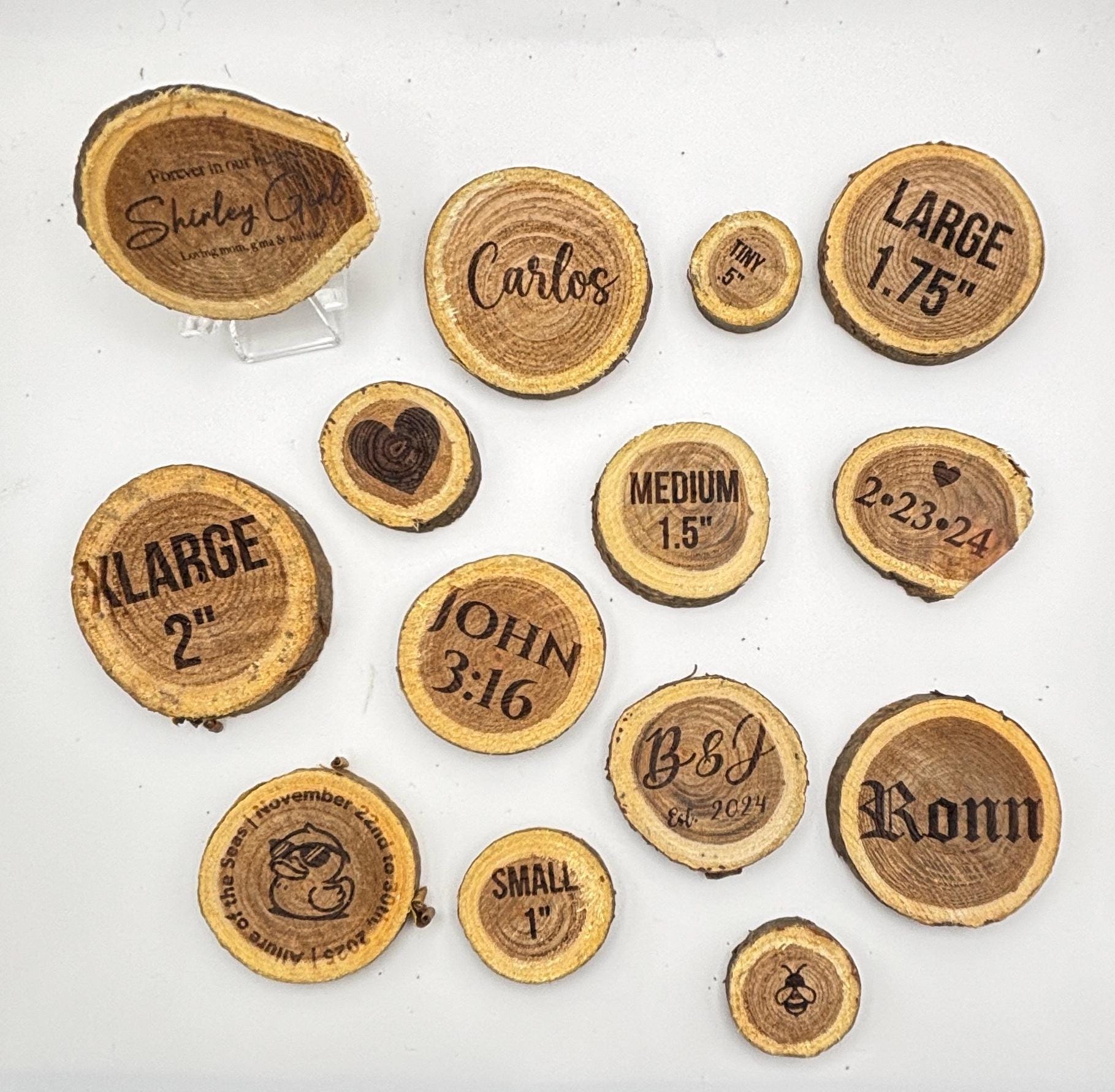 A top-down view showing multiple natural wood slices of differing sizes, each featuring unique engravings.