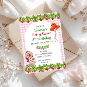 May include: A pink and white gingham birthday invitation with strawberry and leaf border. The invitation reads "Lauren's Berry Sweet 2nd Birthday" with the date and time. A cartoon character holds a pink cat. The address and RSVP information are also included.