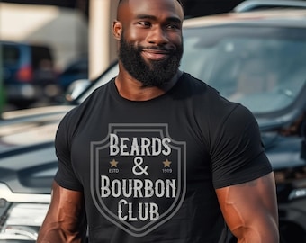 May include: A black t-shirt with a gray shield-shaped graphic that says "BEARDS & BOURBON CLUB" with gold stars and the text "ESTD 1919".