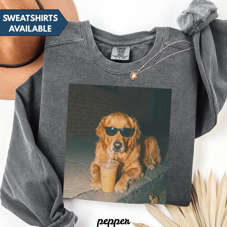 Dark grey sweatshirt with a golden retriever wearing sunglasses holding a coffee.