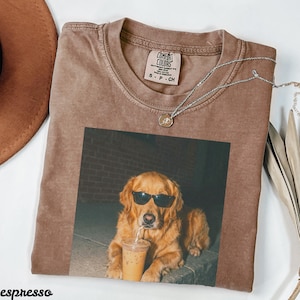 Brown t-shirt with a golden retriever wearing sunglasses and drinking from a cup.