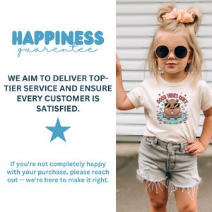 May include: A young child wearing a beige t-shirt with a graphic of a cartoon beaver in sunglasses in a pool, with the text "GOOD VIBES ONLY". The child is also wearing gray shorts and sunglasses.