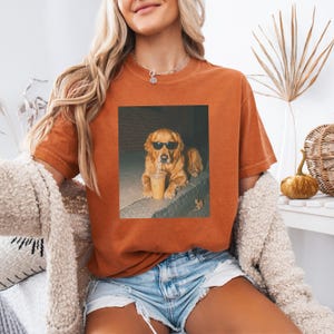 Golden retriever wearing sunglasses with a coffee drink.