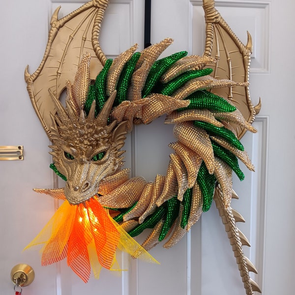 Gold and green dragon with lighted flame! Beautiful gold and emerald green scales, led lights in the flames!