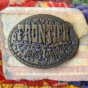 Vintage Frontier Hotel Casino Las Vegas Nevada Brass Belt Buckle 3-1/4x2-1/2&quot;