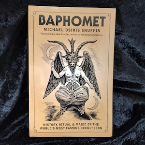 May include: A gold book cover with the title "Baphomet" and the author "Michael Osiris Snuffin". The cover features a black and white illustration of a goat-like figure with wings and horns, sitting on a throne.