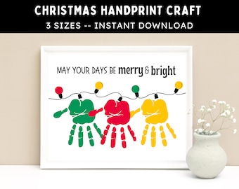 May include: A framed Christmas handprint craft with the text "MAY YOUR DAYS BE merry & bright." The artwork features green, red, and yellow handprints with string lights. The top text reads "CHRISTMAS HANDPRINT CRAFT" and "3 SIZES -- INSTANT DOWNLOAD."