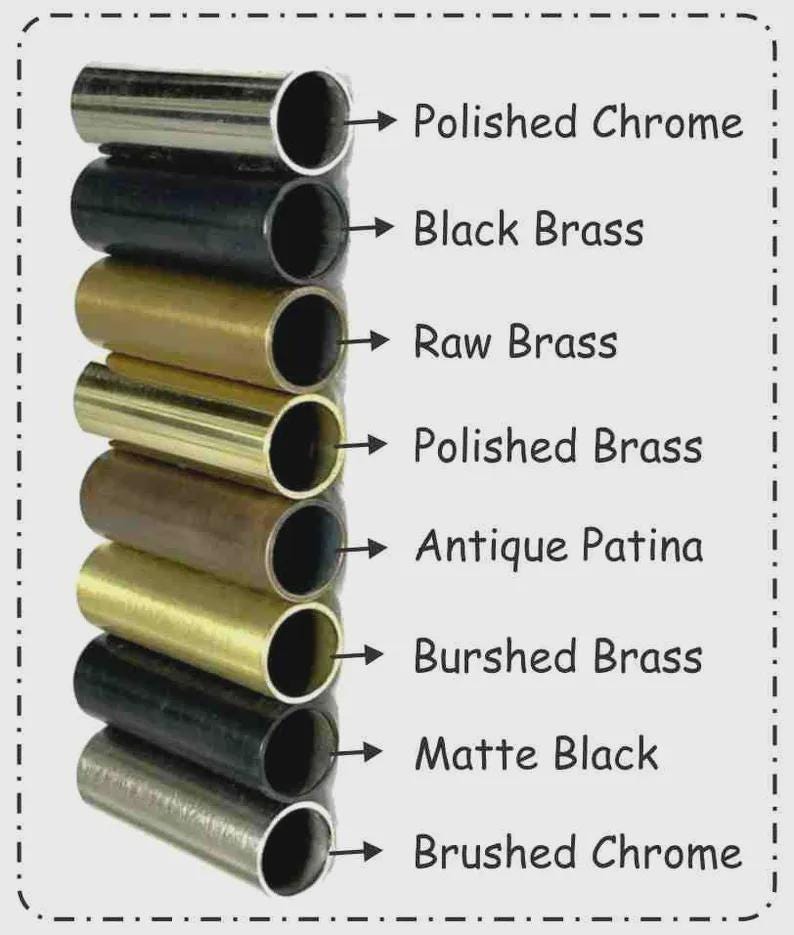 May include: A stack of metal tubes in various finishes, including polished chrome, black brass, raw brass, polished brass, antique patina, brushed brass, matte black, and brushed chrome. Text labels each finish.