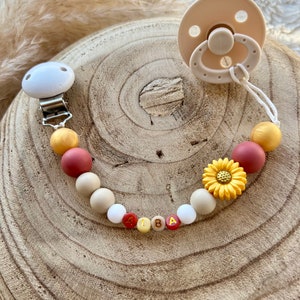 Personalized pacifier clip for baby girl with gold flower