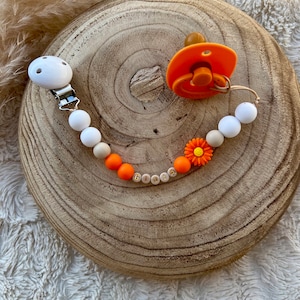 Personalized pacifier clip for baby girl with orange flower