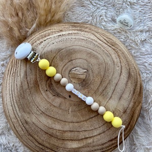 Personalized pacifier clip for baby girl or boy in yellow color