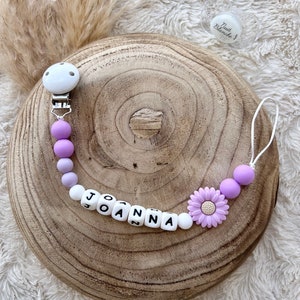 Personalized pacifier clip for baby girl with purple flower.