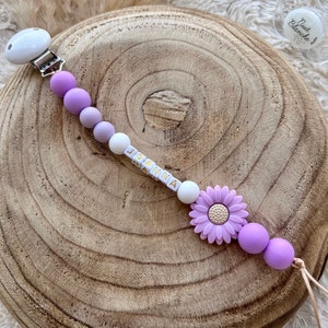 Personalized pacifier clip for baby girl with purple flower.