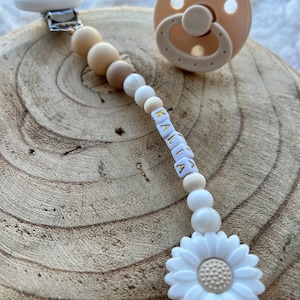 Personalized pacifier clip for baby girl in beige and white with flower