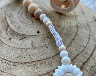 Personalized pacifier clip for baby girl in beige and white color with flower