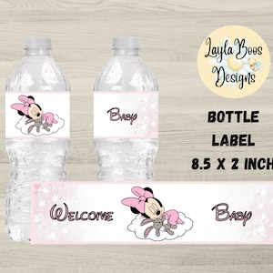 May include: Water bottle labels with a Minnie Mouse theme. The labels feature Minnie Mouse in a pink bow and dress, sleeping on a cloud with a stuffed bunny. The labels also include the word "Baby" and "Welcome". The label size is 8.5 x 2 inches.