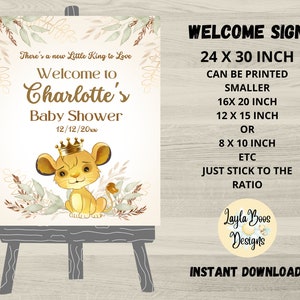 May include: A baby shower welcome sign on an easel. The sign features a cartoon lion wearing a crown, with text that reads "Welcome to Charlotte's Baby Shower." The sign is 24 x 30 inches and can be printed smaller.