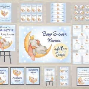May include: A baby shower bundle with a blue and white color scheme featuring a sleeping elephant on a crescent moon. The bundle includes invitations, welcome banners, cupcake toppers, games, and signs. The text on the sign reads "Welcome to Charlotte's Baby Shower 12/12/20".