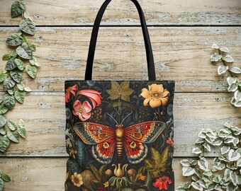 May include: A black canvas tote bag with a colorful butterfly and floral design. The butterfly has red, orange, and blue wings and is surrounded by flowers in shades of pink, yellow, and green.