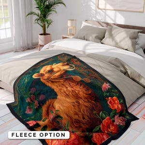 May include: A fleece blanket with a camel portrait surrounded by colorful flowers. The camel is brown and has a gold bridle. The background is a dark green with gold accents.