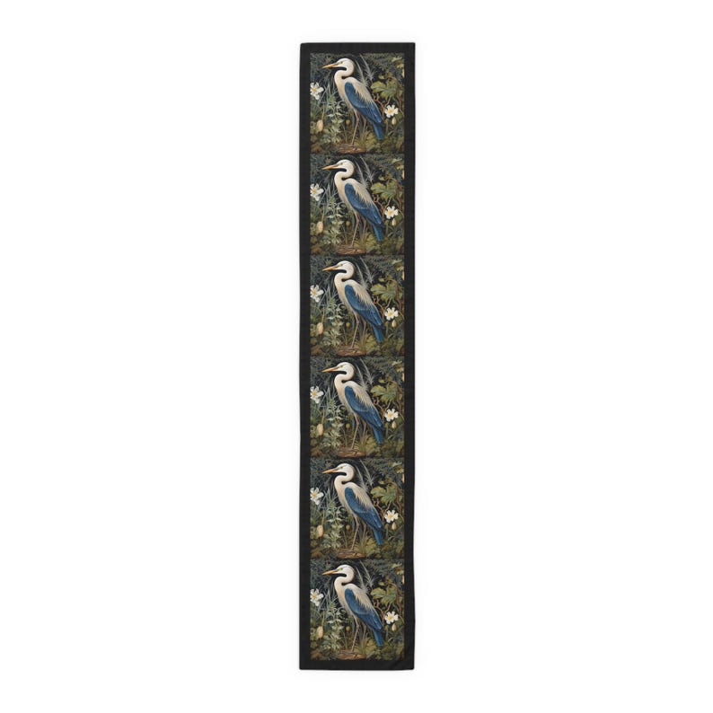 A William Morris inspired table runner featuring the graceful heron (or egret). This elegant piece brings botanical wildlife art to life, perfect for elevating your table setting and enhancing your dining room decor with nature-inspired design.