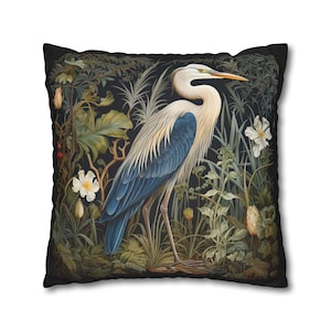 A William Morris inspired pillow featuring a Heron, perfect for Victorian and botanical decor. This decorative cushion fits beautifully on a couch, bed, or armchair, adding a touch of natural elegance and charm to indoor settings.