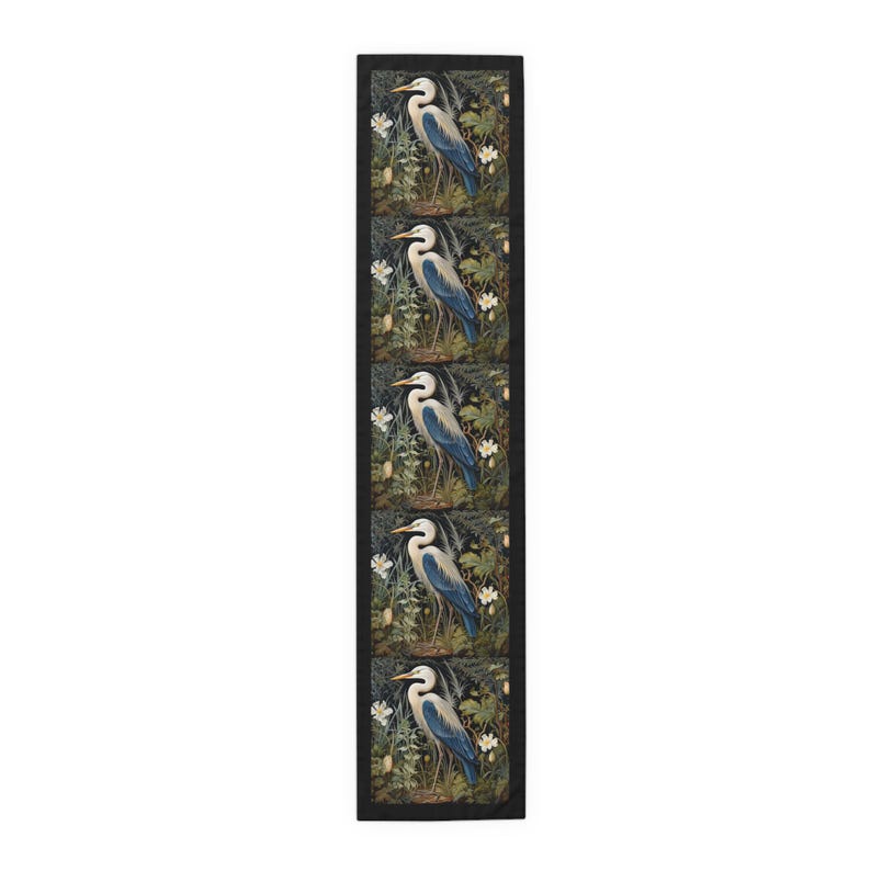 A William Morris inspired table runner featuring the graceful heron (or egret). This elegant piece brings botanical wildlife art to life, perfect for elevating your table setting and enhancing your dining room decor with nature-inspired design.