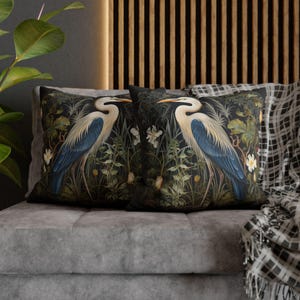 A William Morris inspired pillow featuring a Heron, perfect for Victorian and botanical decor. This decorative cushion fits beautifully on a couch, bed, or armchair, adding a touch of natural elegance and charm to indoor settings.