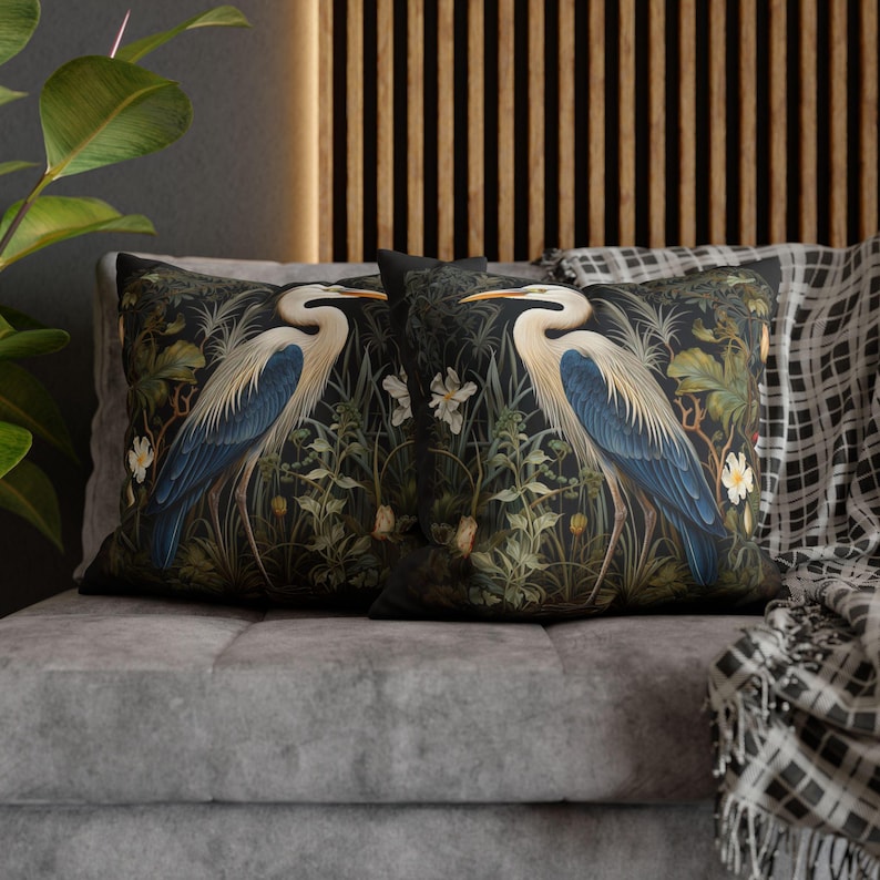 A William Morris inspired pillow featuring a Heron, perfect for Victorian and botanical decor. This decorative cushion fits beautifully on a couch, bed, or armchair, adding a touch of natural elegance and charm to indoor settings.