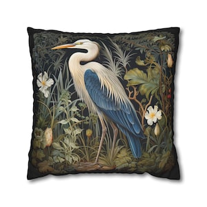 A William Morris inspired pillow featuring a Heron, perfect for Victorian and botanical decor. This decorative cushion fits beautifully on a couch, bed, or armchair, adding a touch of natural elegance and charm to indoor settings.