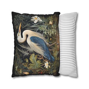 A William Morris inspired pillow featuring a Heron, perfect for Victorian and botanical decor. This decorative cushion fits beautifully on a couch, bed, or armchair, adding a touch of natural elegance and charm to indoor settings.