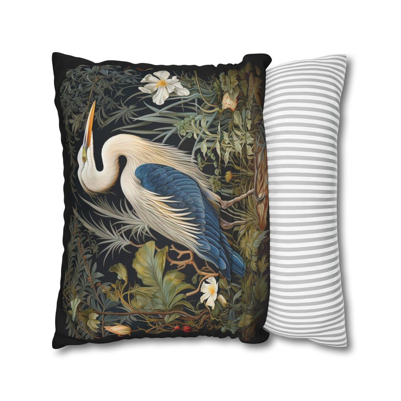 A William Morris inspired pillow featuring a Heron, perfect for Victorian and botanical decor. This decorative cushion fits beautifully on a couch, bed, or armchair, adding a touch of natural elegance and charm to indoor settings.