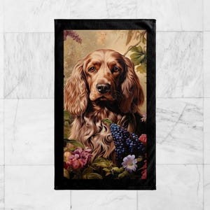 May include: A brown and white dog with long, flowing hair is surrounded by flowers and grapes. The dog is looking directly at the viewer with a serious expression. The background is a soft, muted green.