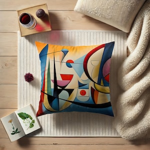 May include: A colorful abstract pillow featuring geometric shapes and lines in shades of blue, yellow, red, and white. The pillow is a modern and stylish addition to any home decor.