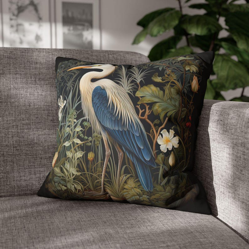 A William Morris inspired pillow featuring a Heron, perfect for Victorian and botanical decor. This decorative cushion fits beautifully on a couch, bed, or armchair, adding a touch of natural elegance and charm to indoor settings.