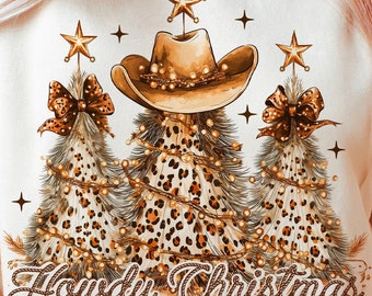 May include: Beige sweatshirt featuring a festive design. The graphic includes a cowboy hat, leopard print Christmas trees, and the text "Howdy Christmas". The design is embellished with stars and string lights.
