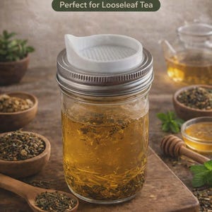 May include: A set of three ceramic mugs with a speckled, matte finish. The mugs are in shades of cream, light gray, and dark gray. Each mug has a simple, minimalist design and a rounded handle.