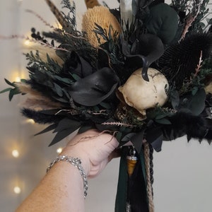 Dried & Artificial Flowers. Gothic Autumnal ~ Skull Bridal Bouquet in Black and Dark Green with moonstone healing crystal tower.