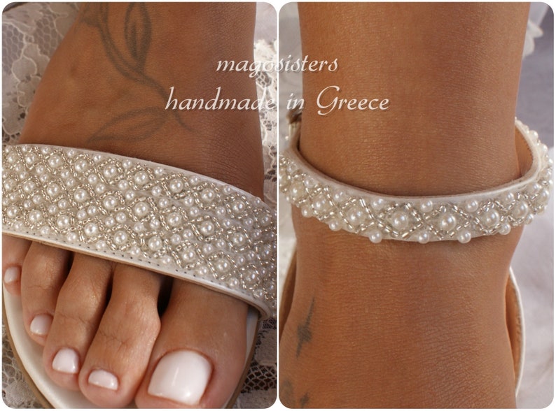 May include: White sandals with a pearl and silver beaded strap. The sandals are handmade in Greece.