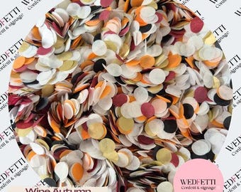 May include: A collection of circular confetti pieces in a mix of wine red, autumn orange, metallic gold, black, and white colors. The confetti is arranged in a circular shape, with the text Wine Autumn Gold Black visible at the bottom left.