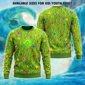 May include: A long-sleeve crewneck sweatshirt featuring a vibrant green moss-like texture pattern with scattered colorful flowers and a central spiral emblem. The text AVAILABLE SIZES FOR KID/YOUTH/ADULT is printed at the top of the image.