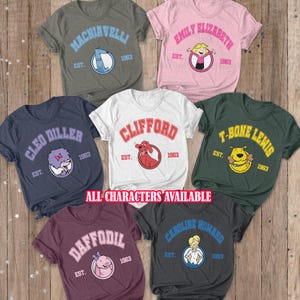 May include: Assorted t-shirts featuring cartoon characters and names like "Machiavelli," "Emily Elizabeth," and "Clifford." Each shirt has a character graphic and the year "1963." The shirts are in various colors, including gray, pink, white, and navy.