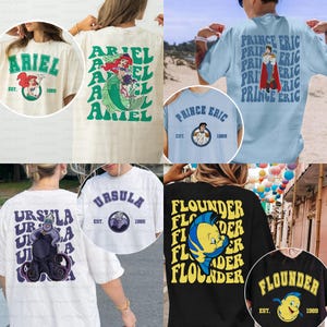 Puede incluir: Colección de camisetas con personajes de una popular película de animación. Los diseños incluyen "Ariel", "Príncipe Eric", "Ursula" y "Flounder", cada uno con ilustraciones de personajes y el año "1989". Las camisetas son de varios colores, incluyendo blanco, negro y azul.